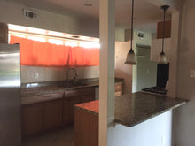 Load image into Gallery viewer, PENDING Mid-Century Modern 4/2/2 w/in-law,AIRBnB or subdivide Possibilities Have a unique chance to own an amazing flat roof 4/2/2 on a huge corner lot