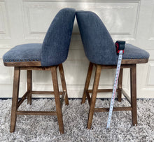Load image into Gallery viewer, A pair of gorgeous swivel barstools upholstered/ studded with wood/chrome bases