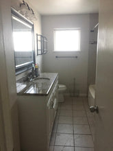 Load image into Gallery viewer, PENDING Mid-Century Modern 4/2/2 w/in-law,AIRBnB or subdivide Possibilities Have a unique chance to own an amazing flat roof 4/2/2 on a huge corner lot